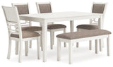 Close-up of antique white dining table edge and tapered leg
