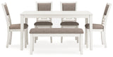 Front view of Erinberg dining chairs with light gray upholstery and fretwork backs