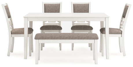 Front view of Erinberg dining chairs with light gray upholstery and fretwork backs