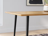 Close-up detail of acacia wood tabletop and black leg connection