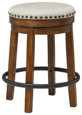 Valebeck counter height swivel stool side view showing nailhead trim