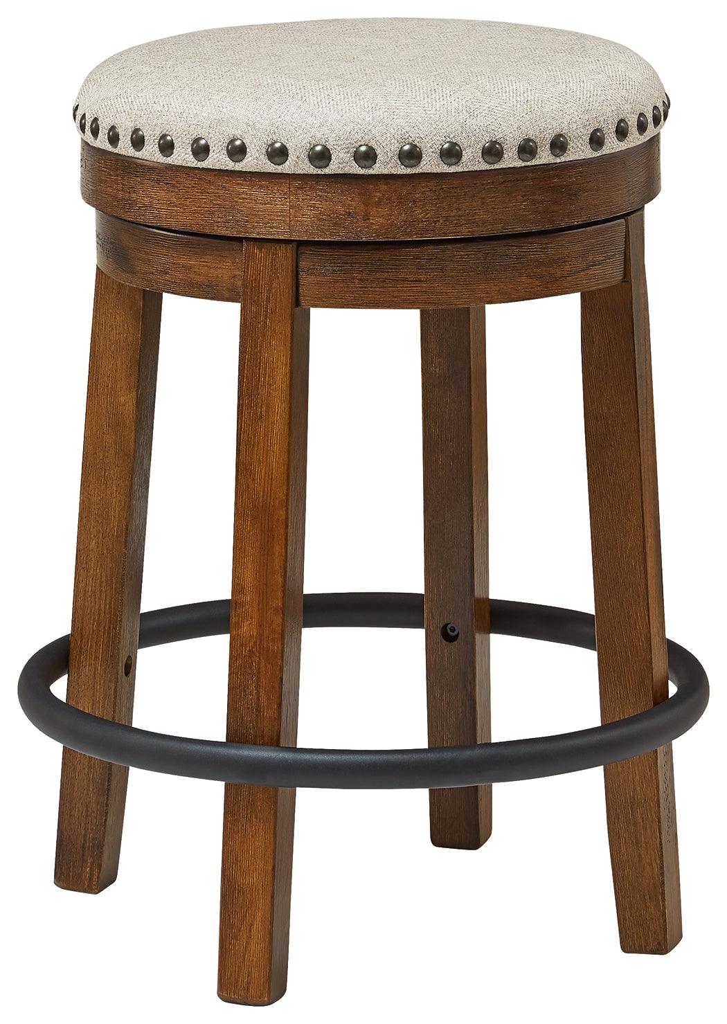 Valebeck counter height swivel stool side view showing nailhead trim