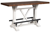 Side view of Valebeck Counter Height Dining Table with black metal footrest