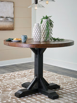 Valebeck dining table angled side view showing two-tone finish