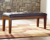 Ralene dining bench medium brown faux leather seat angled front