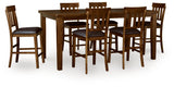 Close-up of distressed medium brown wood finish on dining table corner