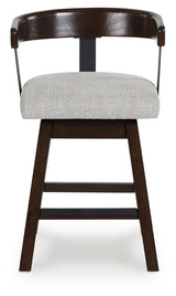 Barstool seat detail showing wood frame and fabric upholstery