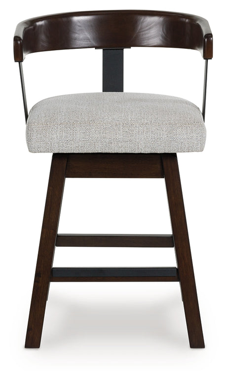 Barstool seat detail showing wood frame and fabric upholstery
