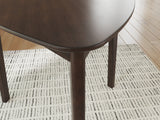 Close-up of Mallenette Merlot Dining Table finish detail