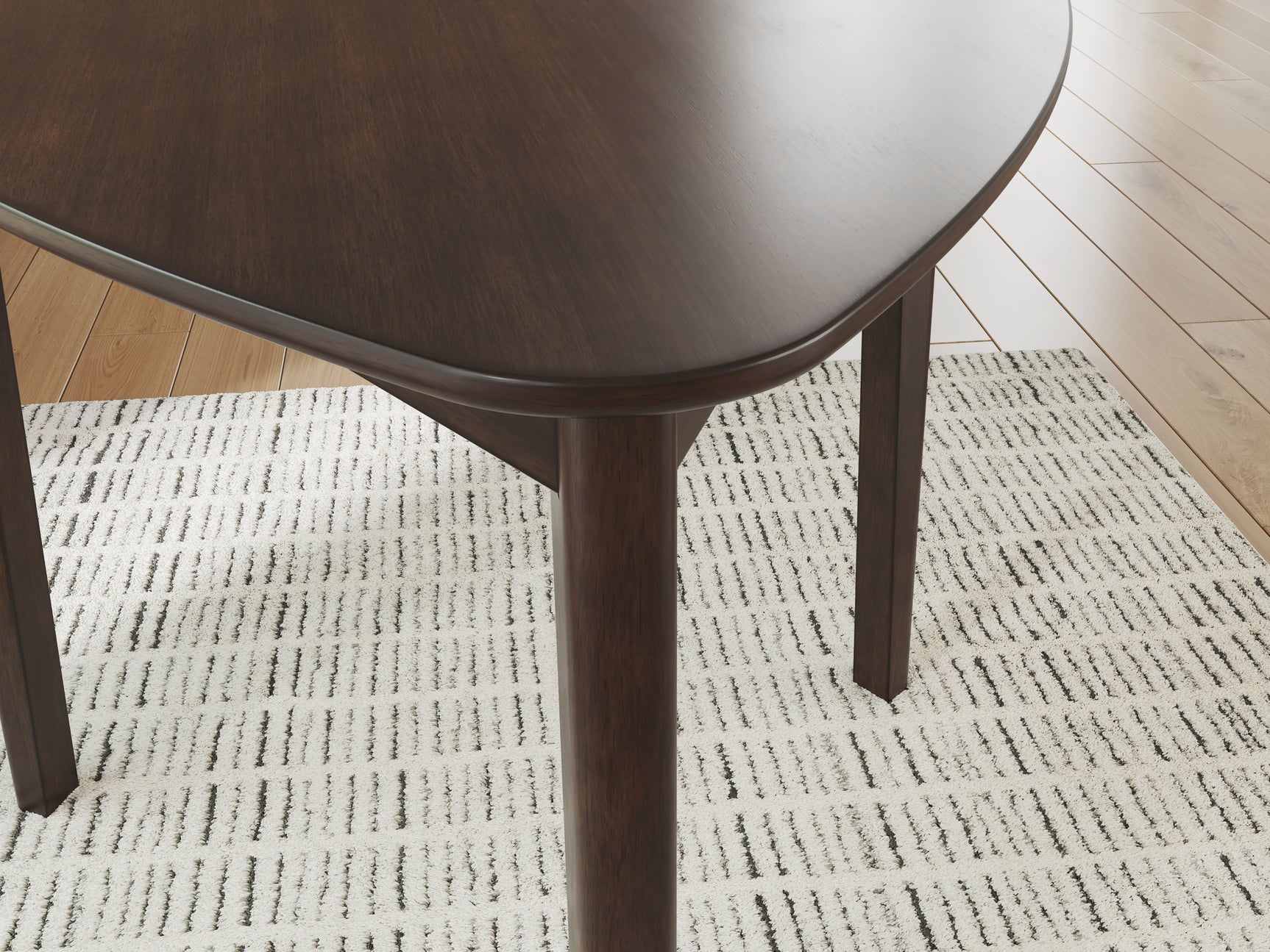 Close-up of Mallenette Merlot Dining Table finish detail