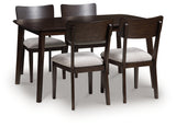 Mallenette dining table side angle showing rich wood veneer finish