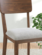 Wood-tone finish detail on Tameride chair frame