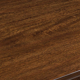 Detail view of medium brown finish on Tameride dining table