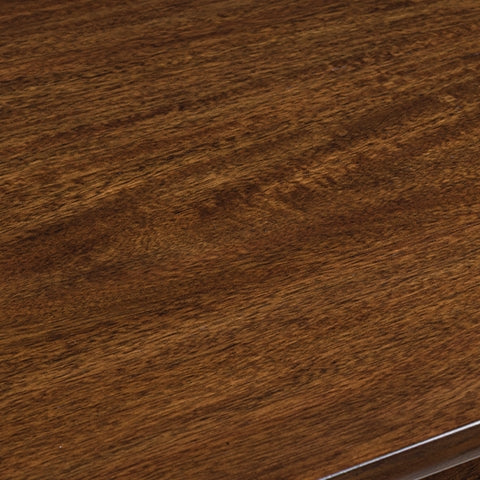 Detail view of medium brown finish on Tameride dining table
