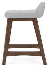 Close-up of Lyncott bar stool wood frame finish and upholstery texture
