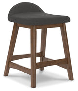 Lyncott charcoal brown upholstered bar stool angle view