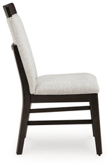 Angled view of dark gray-brown wood frame on Neymorton chair