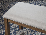 Close-up of Moriville Dining Bench beige upholstery and nailhead trim