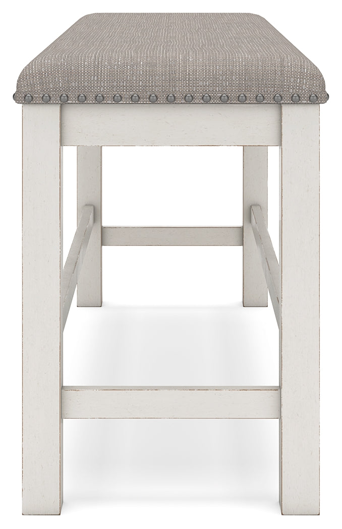 Barstools arranged around counter height table
