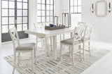 Side angle of Robbinsdale Antique White counter height dining table