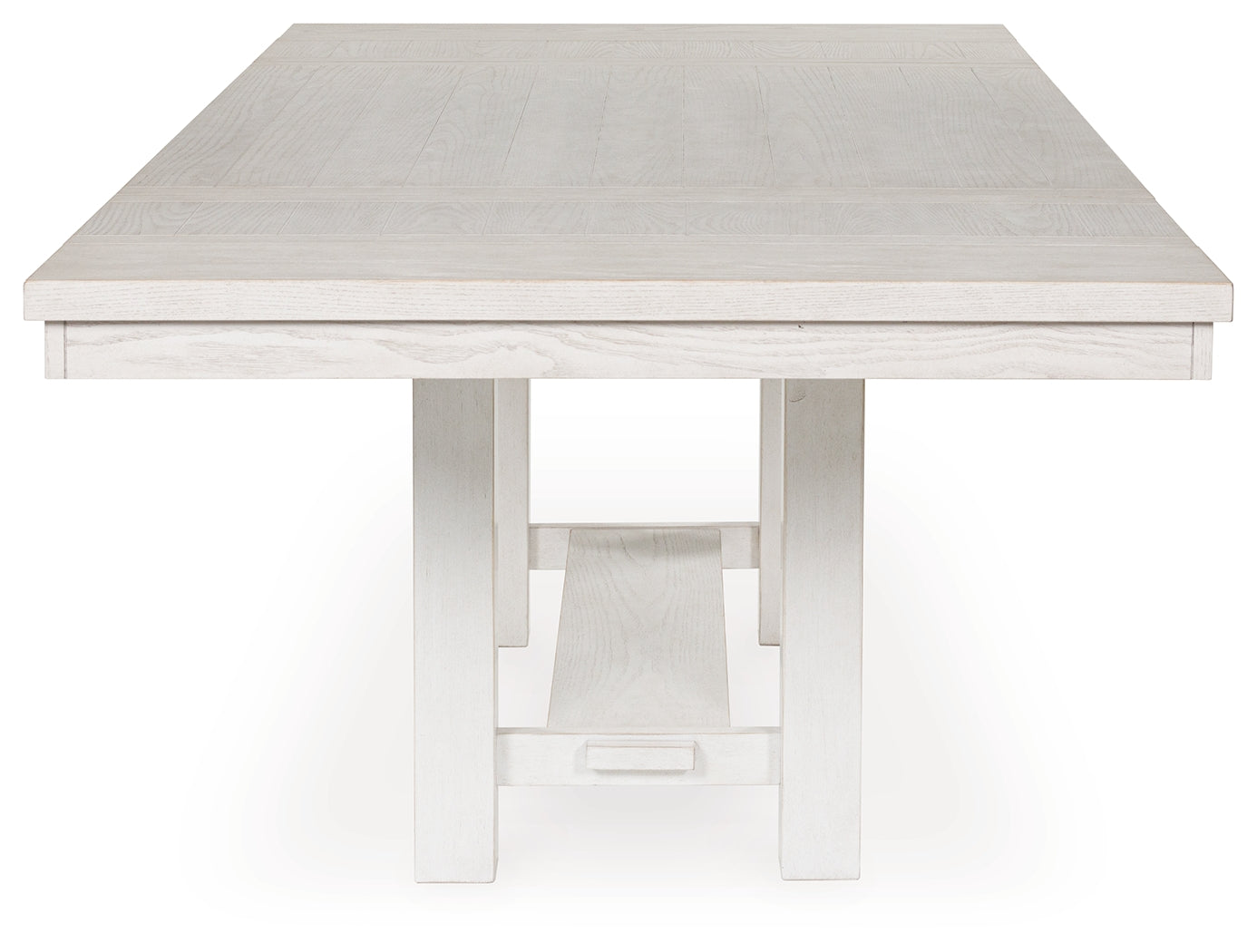 Side angle showing trestle base of Robbinsdale Dining Table
