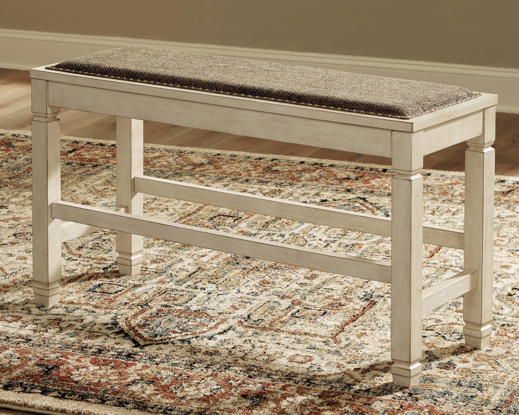 Bolanburg two-tone counter height dining bench close-up of nailhead trim