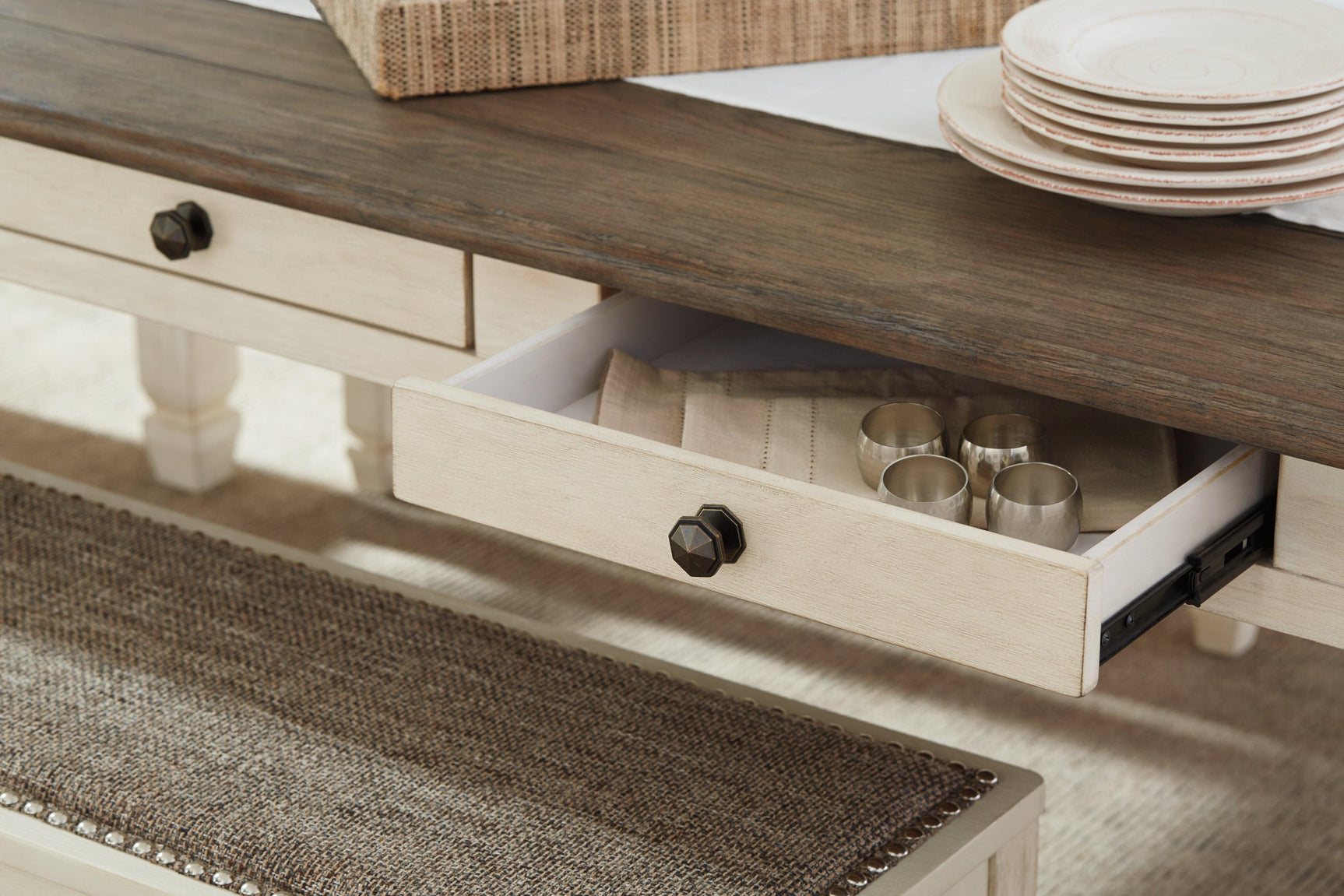 Detail of drawer hardware and apron on Bolanburg Dining Table