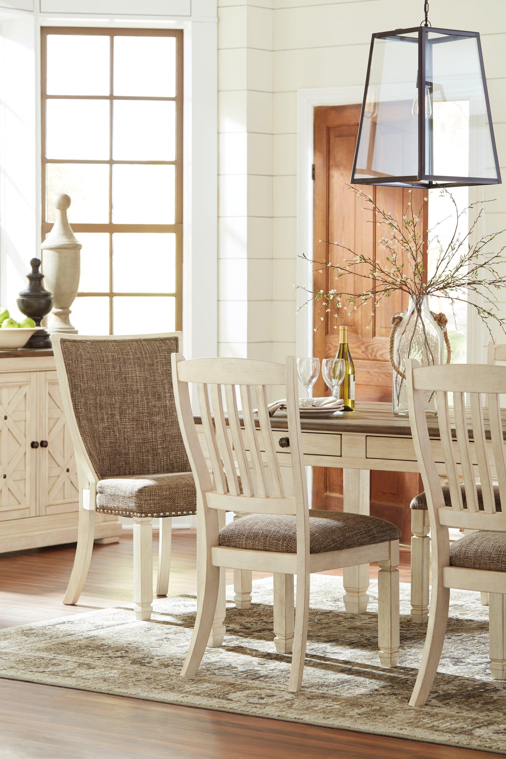 Mood image showing table with six chairs in warm light
