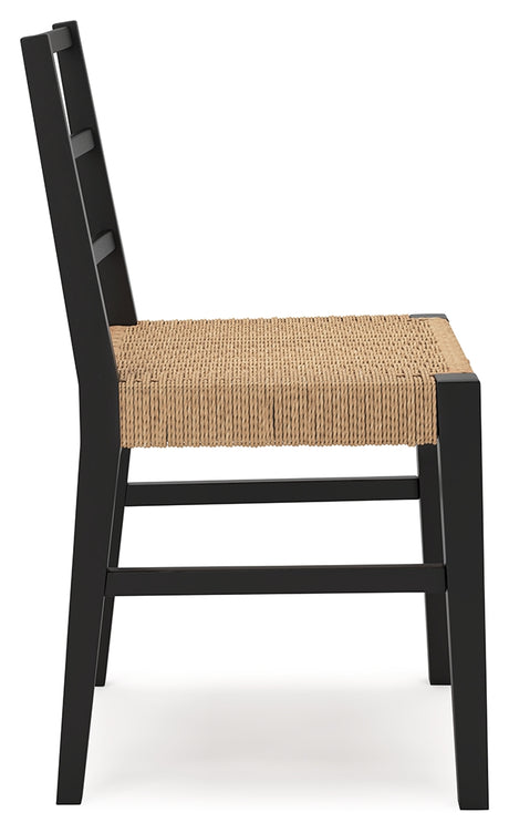 Isanti dining chair with black wood frame and rattan seat detail