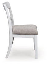 Side profile of Greddinton dining chair in antiqued white finish