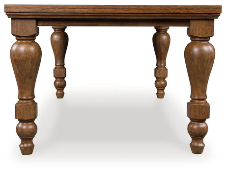 Side view of Greddinton Brown Dining Table showcasing turned leg