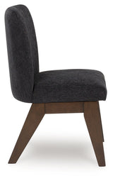 Side view of Dilenno dining chair showing bucket seat design and cushioning