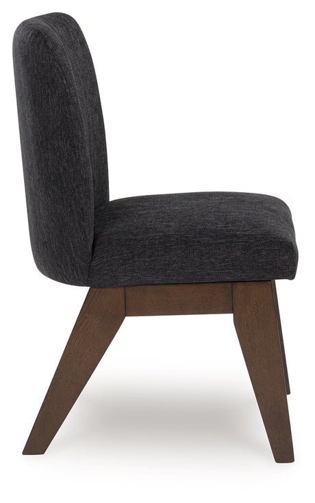 Side view of Dilenno dining chair showing bucket seat design and cushioning