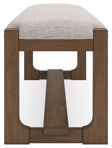 Angled image showing upholstery texture and bench legs of Cabalynn dining bench