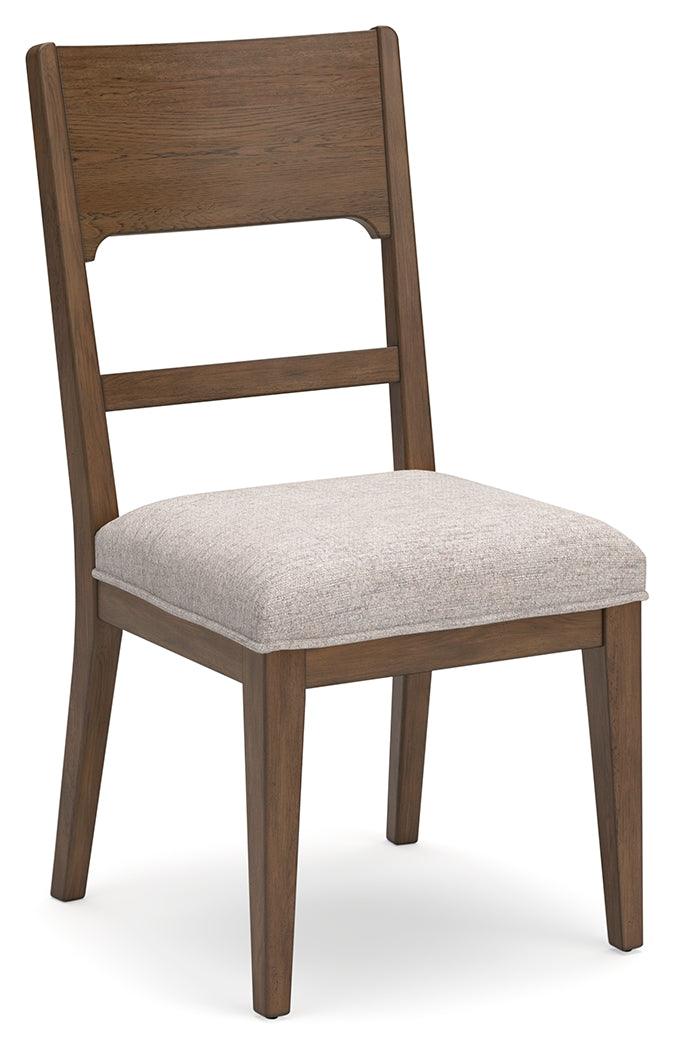 Side view of Cabalynn oatmeal light brown dining chair showing cushioned seat