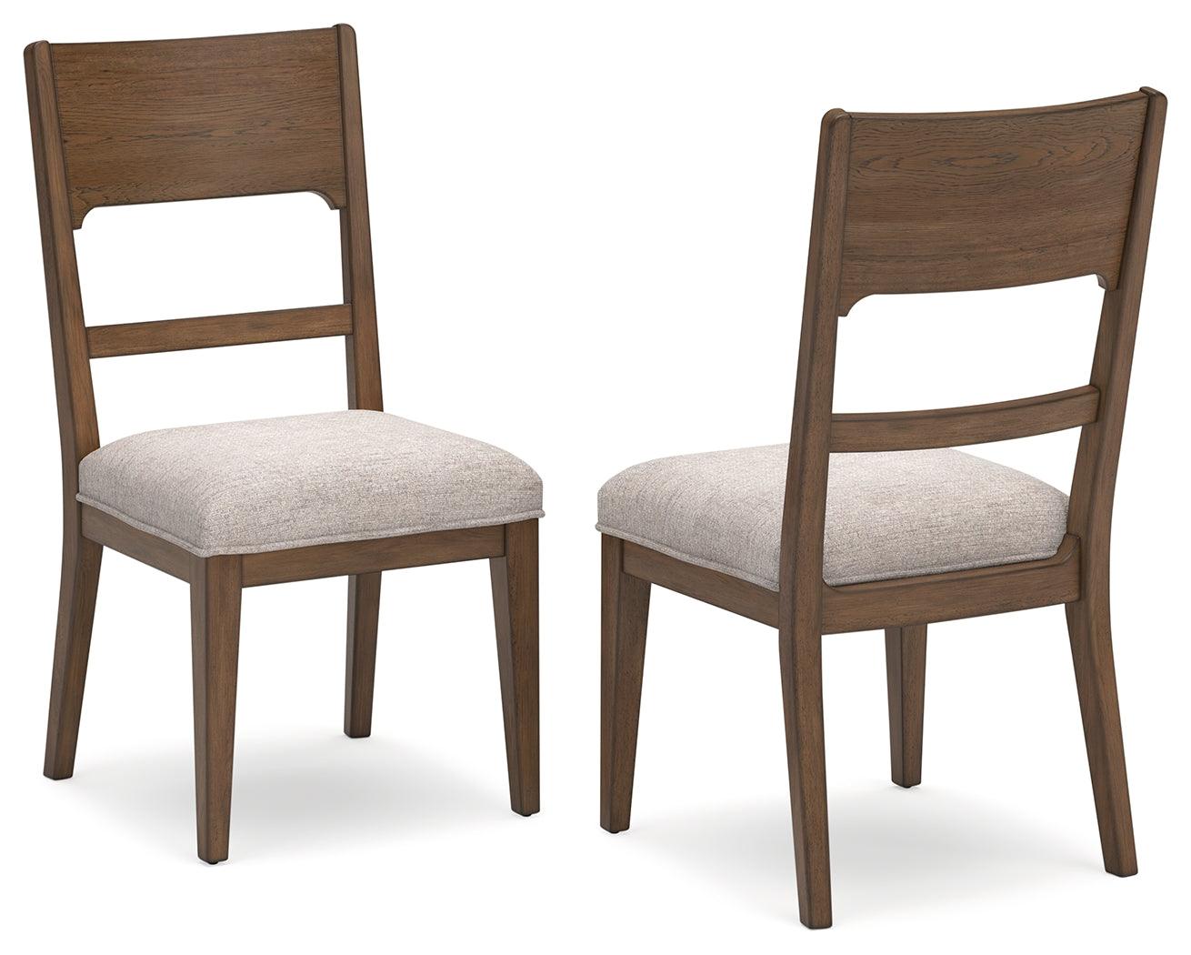 Close-up of cushioned seat on Cabalynn dining chair in oatmeal fabric