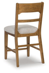 Cabalynn counter height barstool in oatmeal fabric and light brown wood finish