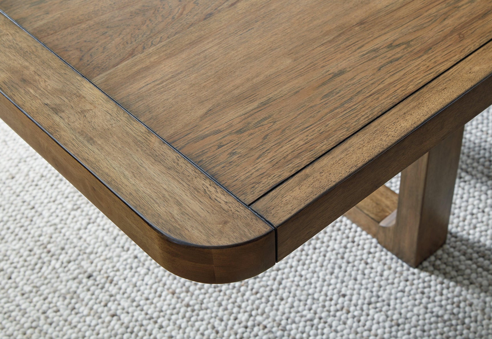 Cabalynn Light Brown Dining Extension Table finish swatch detail
