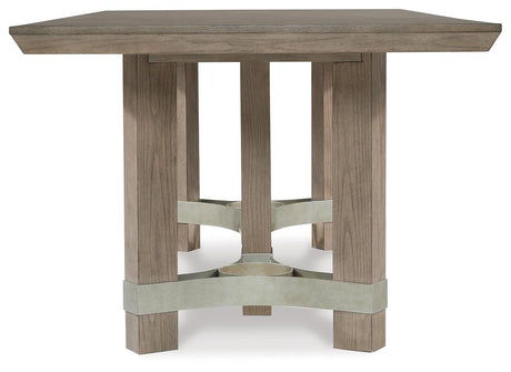 Side view of Chrestner Gray Dining Table showcasing sturdy pedestal base