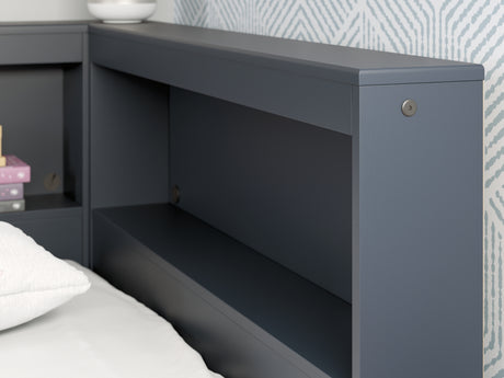 Detail close-up of navy blue finish and USB ports on Simmenfort bed