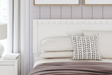 Detail of bed frame headboard scalloped design