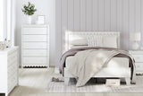 Styled bedroom with Hallityn white platform bed and coastal decor