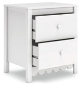 Hallityn Nightstand angled with top drawer open showing storage space