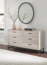 Close-up of dark pewter-tone drawer pulls on Socalle dresser