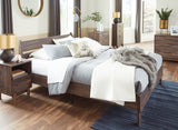 Calverson Mocha Queen Panel Platform Bed - elevated bed frame showing slats