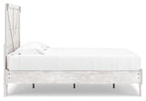 Detail of crossbuck panel and pewter-tone hardware on Shawburn bed in white and charcoal gray