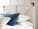 Close-up detail of distressed whitewash finish on Shawburn bed frame