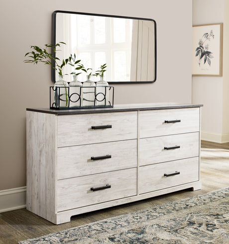 Close-up of pewter-tone hardware on dresser