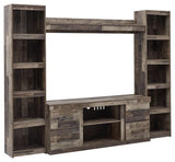Derekson Multi Gray 4-Piece Entertainment Center with TV and decor