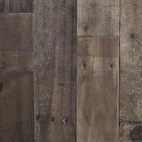 Close-up of Derekson entertainment center's rustic multi gray finish and fireplace detail